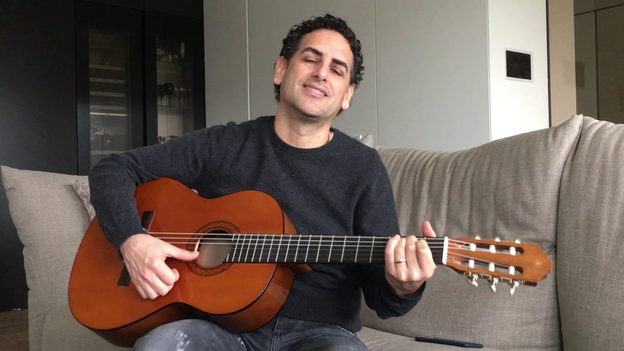 How To Hold Classical Guitar