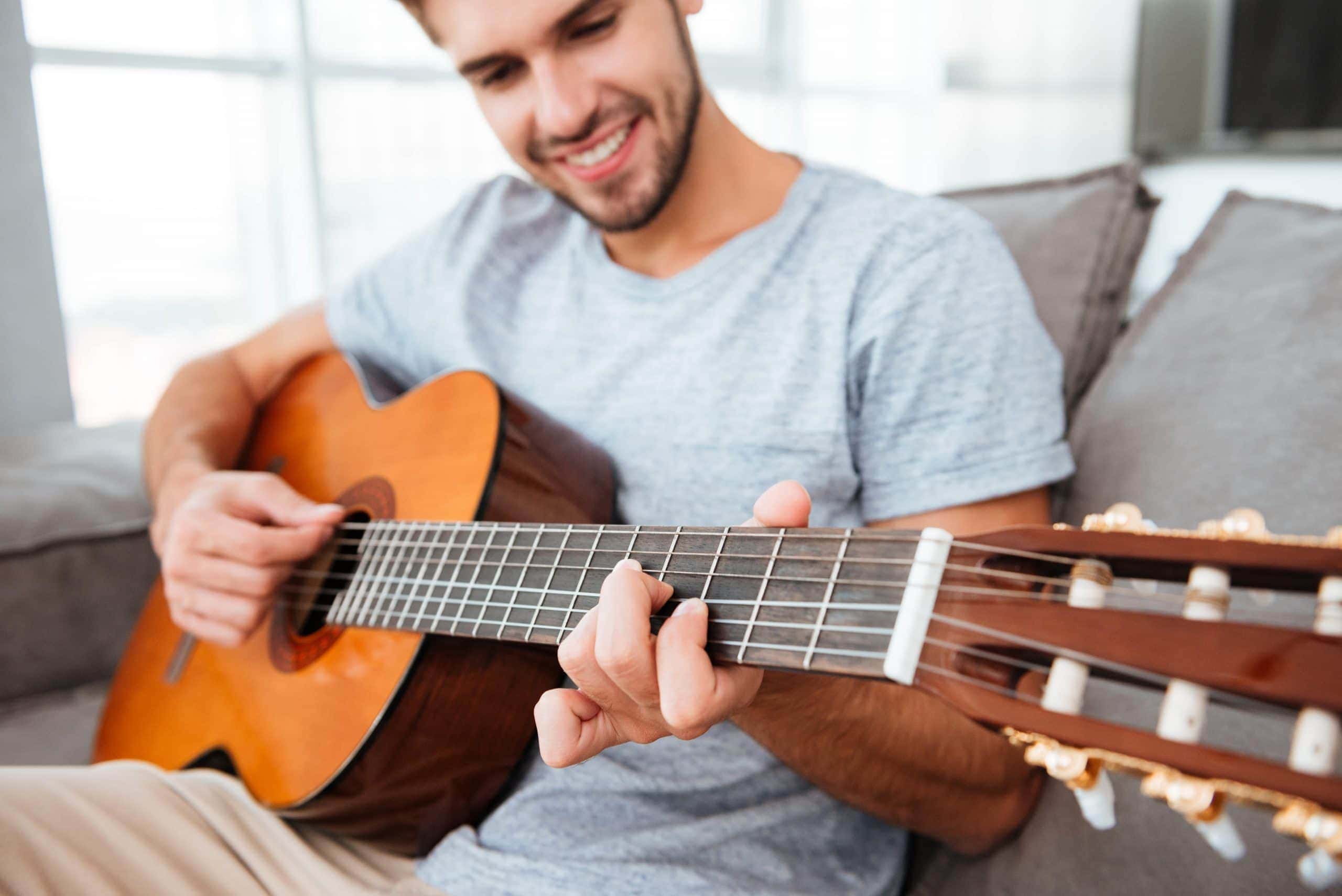 How To Hold An Acoustic Guitar